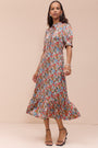 Full length studio shot of the Fabienne floral silk dress.