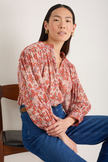 Close-up of the blouson sleeves on the warm clay floral blouse